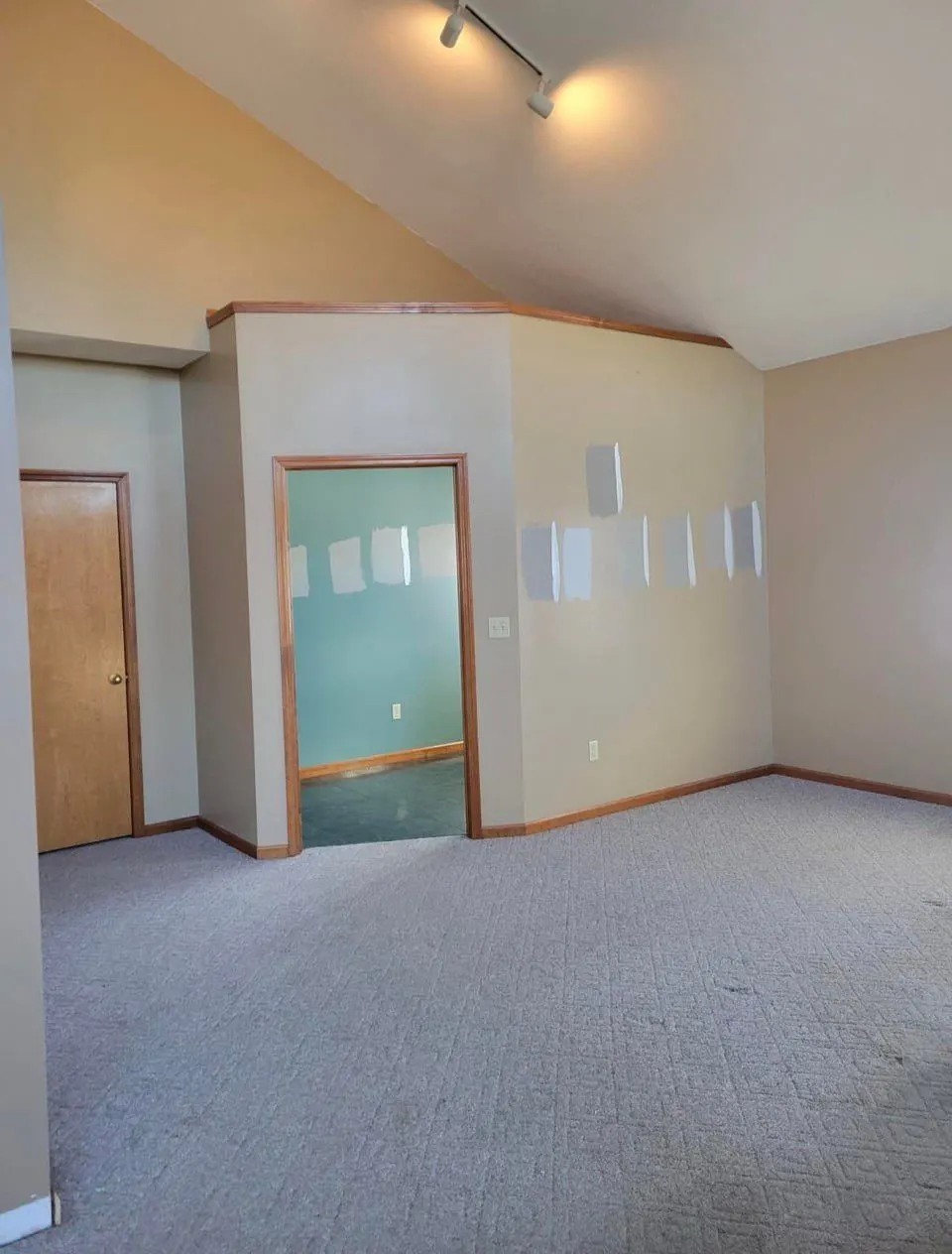 Finished drywall and fresh paint across connecting rooms — Fenelon Handyman Services, Tampa Bay, FL