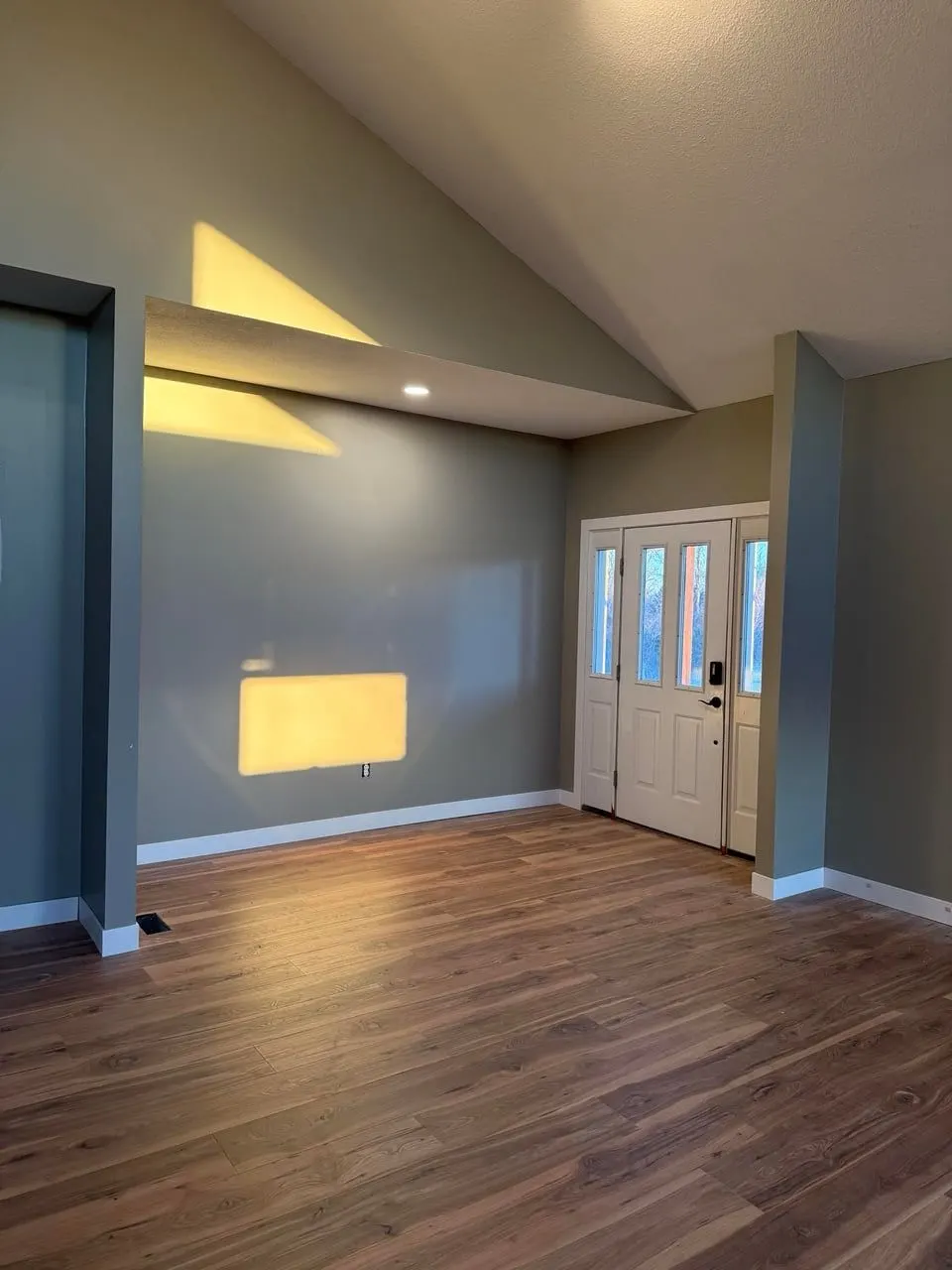 New plank flooring with freshly painted gray walls — Fenelon Handyman Services, Tampa Bay, FL