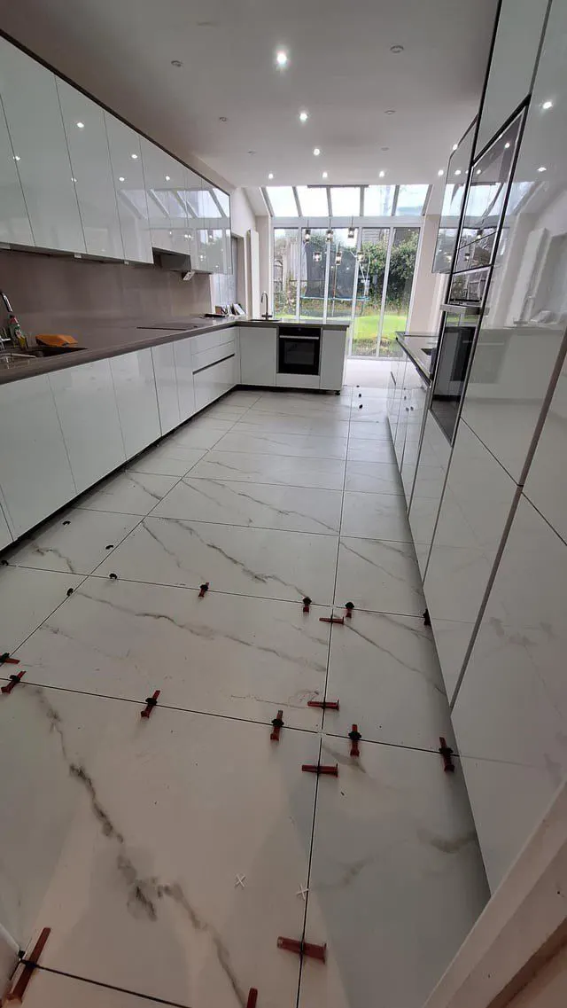 Large-format tile floor installation in progress — Fenelon Handyman Services, Tampa Bay, FL