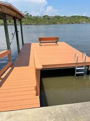 Waterfront dock and deck rebuild with composite boards and benches — Fenelon Handyman Services, Tampa Bay, FL