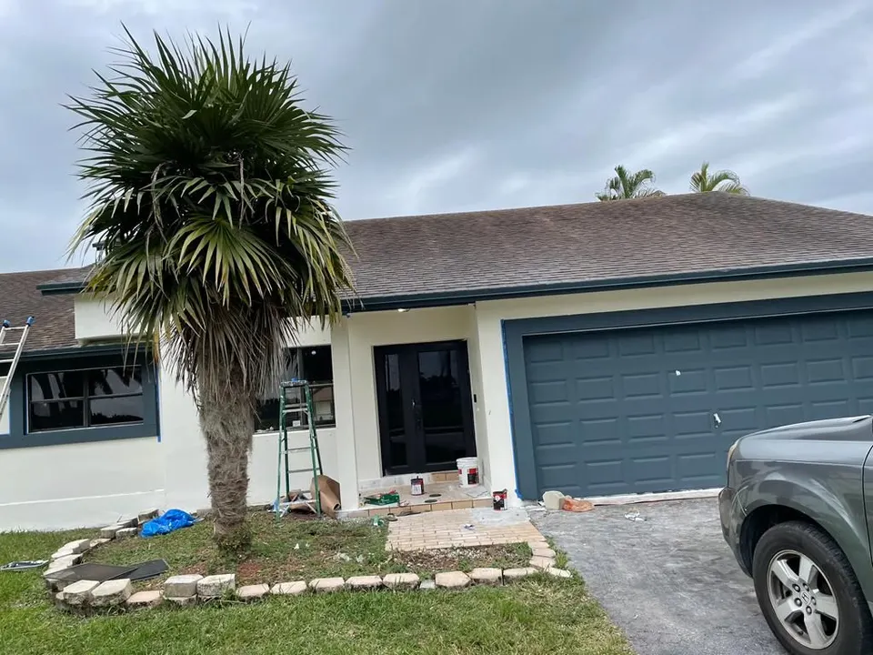 Exterior house painting in progress on a Tampa Bay home — Fenelon Handyman Services, Tampa Bay, FL