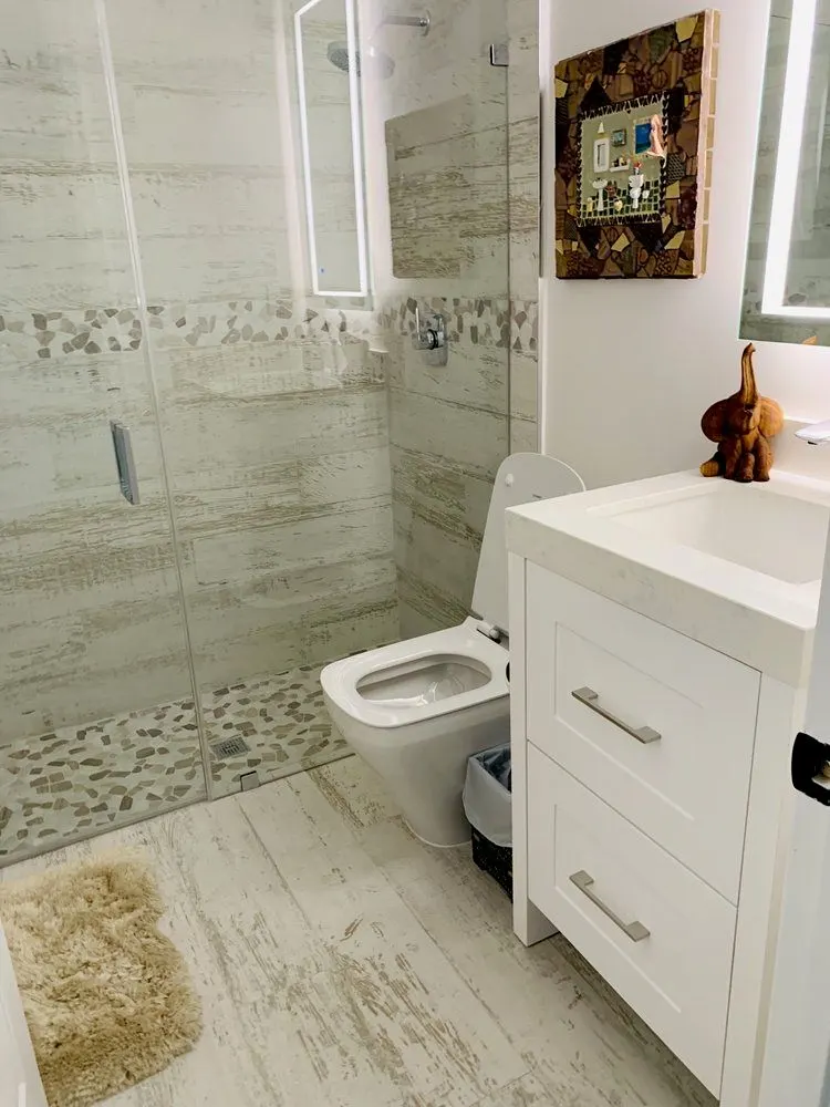 New toilet and vanity installed in a refreshed bathroom — Fenelon Handyman Services, Tampa Bay, FL