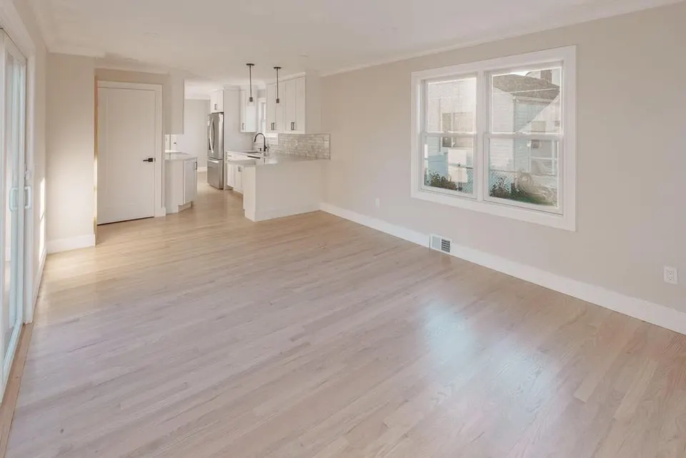 Kitchen island and open living space after remodel — Fenelon Handyman Services, Tampa Bay, FL