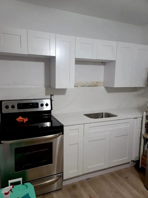 Kitchen refresh with white cabinets and new range — Fenelon Handyman Services, Tampa Bay, FL